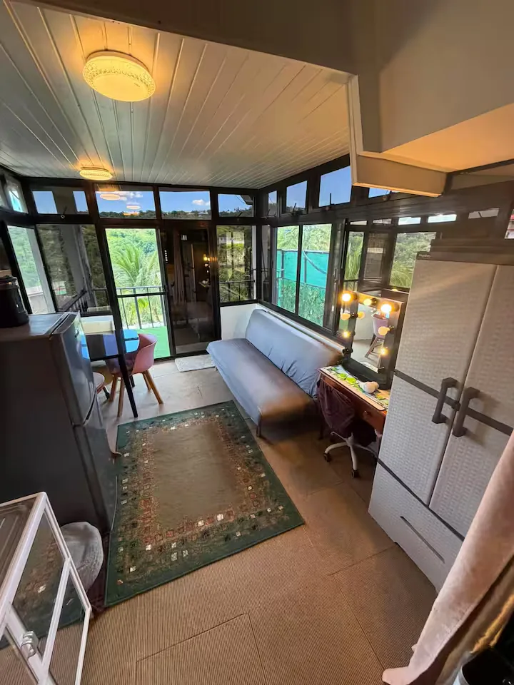 Living space and a compact desk inside Abraham's Upper A-Frame
